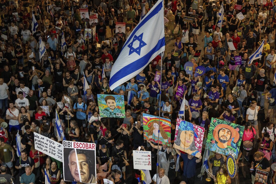 People protest against Prime Minister Benjamin Netanyahu's government and call for the release of hostages held in the Gaza Strip by the Hamas militant group, in Tel Aviv, Israel, Saturday, Aug. 31, 2024.