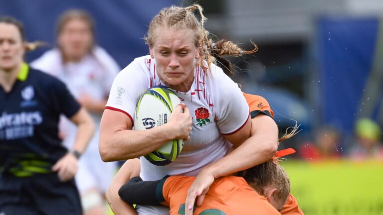 England's Alex Matthews is tackled during the women's rugby World Cup quarterfinal against Australia at Waitakere Stadium in Auckland, New Zealand, Sunday Oct. 30 2022. (Andrew Cornaga/Photosport via AP)