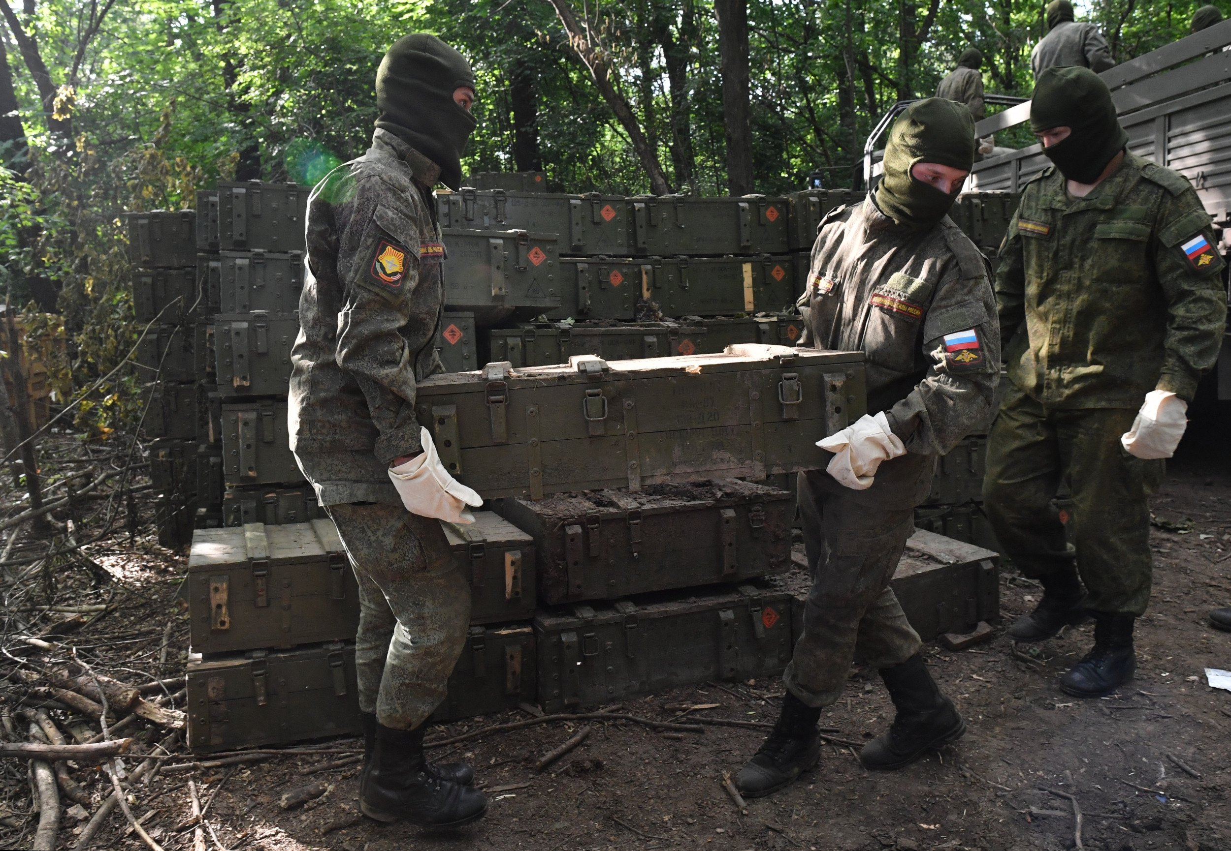 Russian Soldiers Carrying Ammunition Boxes at Depot