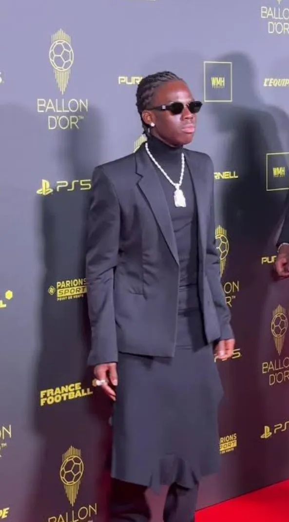 Rema Turns Heads by Wearing Skirt to Ballon d’Or Event