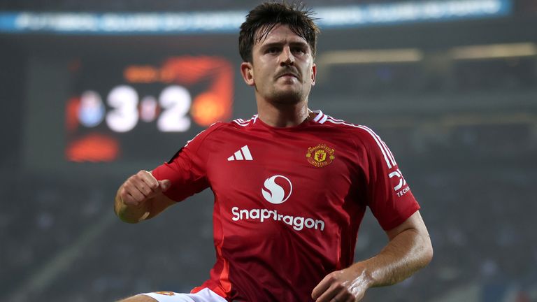 Harry Maguire celebrates his stoppage time equaliser for Manchester United against Porto