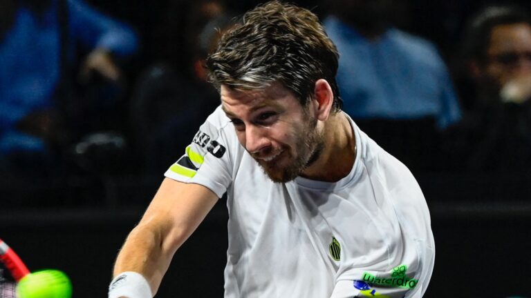 Britain's Cameron Norrie returns a ball to France's Benjamin Bonzi during the at the ATP 250 Moselle Open final match tournament at Les Arenes sports centre in Metz, northeastern France, on November 9, 2024. (Photo by Jean-Christophe VERHAEGEN / AFP)