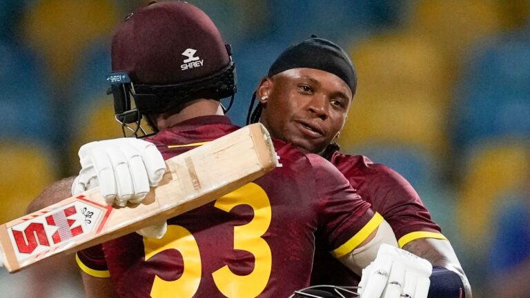 West Indies' Keacy Carty celebrates with teammate Brandon King scoring a century against England during the third ODI cricket match at Kensington Oval in Bridgetown, Barbados, Wednesday, Nov. 6, 2024. (AP Photo/Ricardo Mazalan)