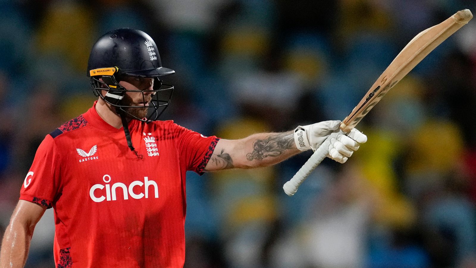 England's Phil Salt acknowledges scoring fifty runs against West Indies during the first T20 cricket match at Kensington Oval in Bridgetown, Barbados