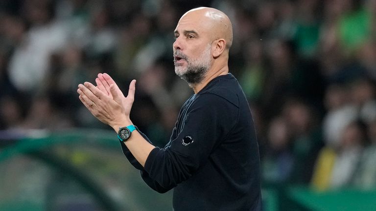 Manchester City's head coach Pep Guardiola reacts during the UEFA Champions League opening phase match between Sporting and Manchester City in Lisbon, Portugal, Tuesday, Nov. 5, 2024. (AP Photo/Armando Franca)